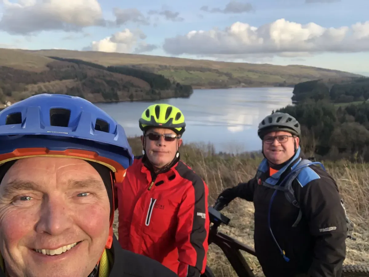 Mountain bike instructor leading a group ride in Merthyr Tydfil